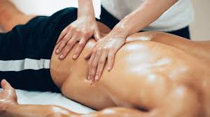 A man getting a massage in a massage room.